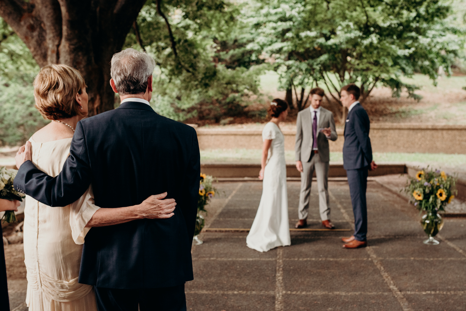 Parents watching their daughter get married dc park wedding