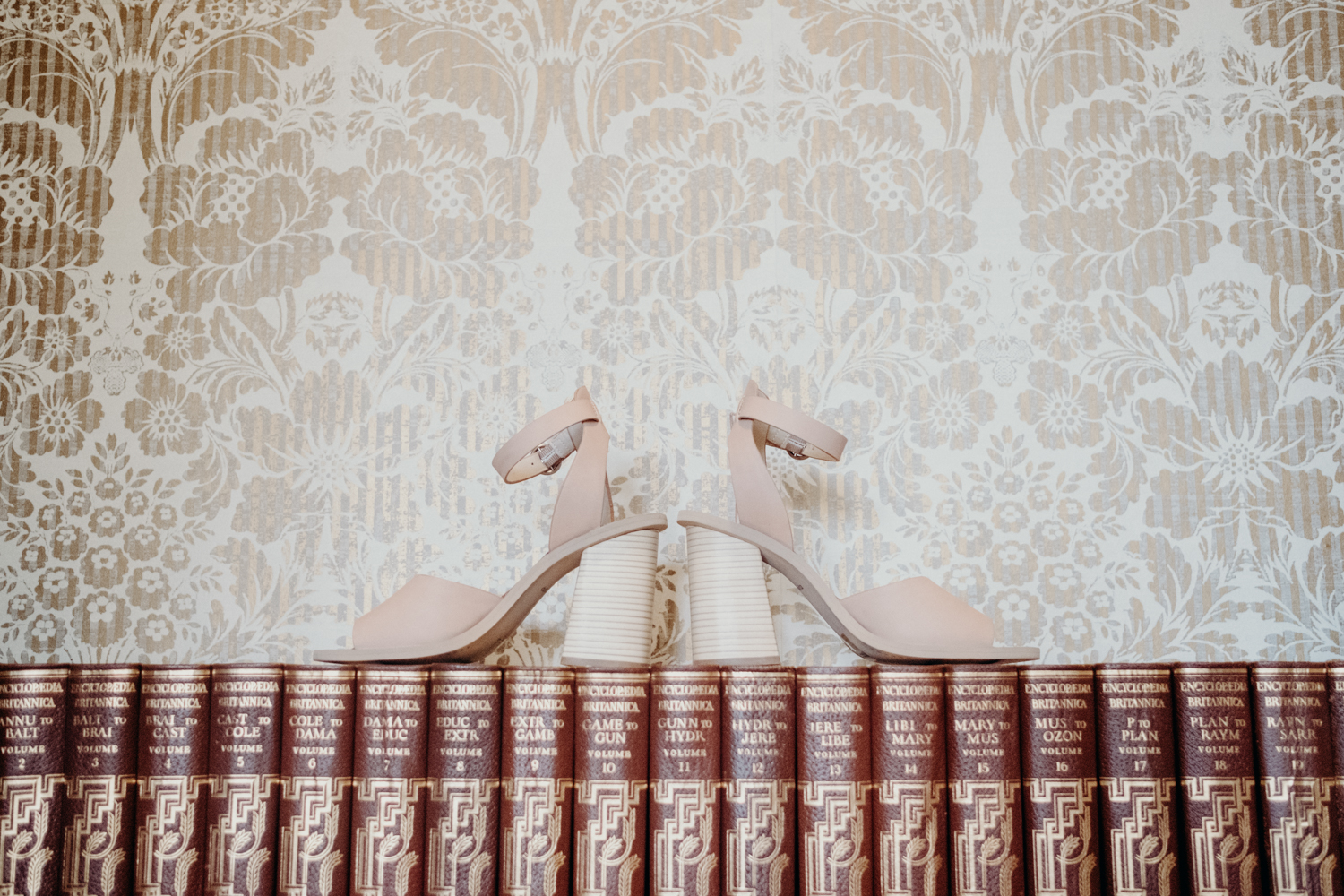 wedding inspiration bride shoes on old books