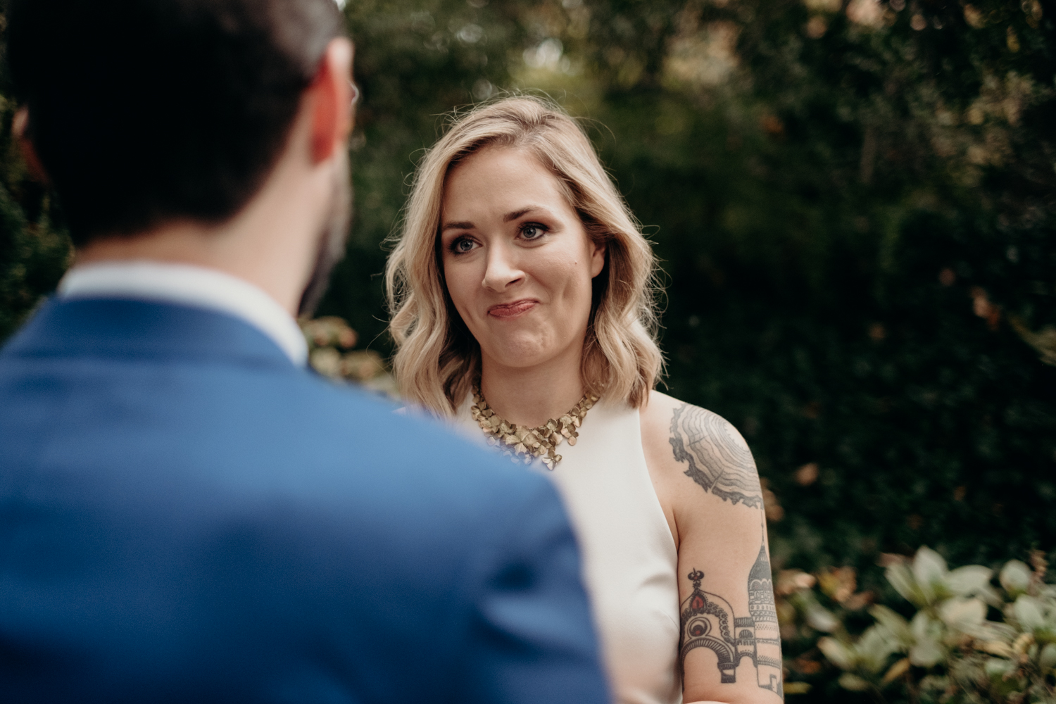 bride listens to wedding vows