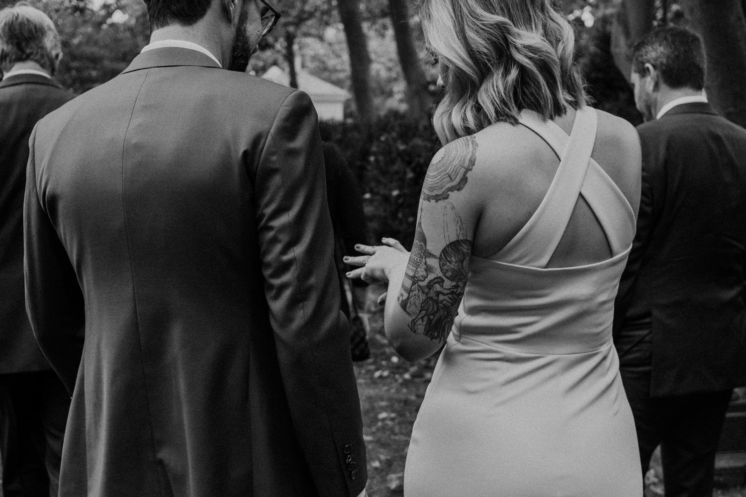 bride admires her new wedding ring after the ceremony