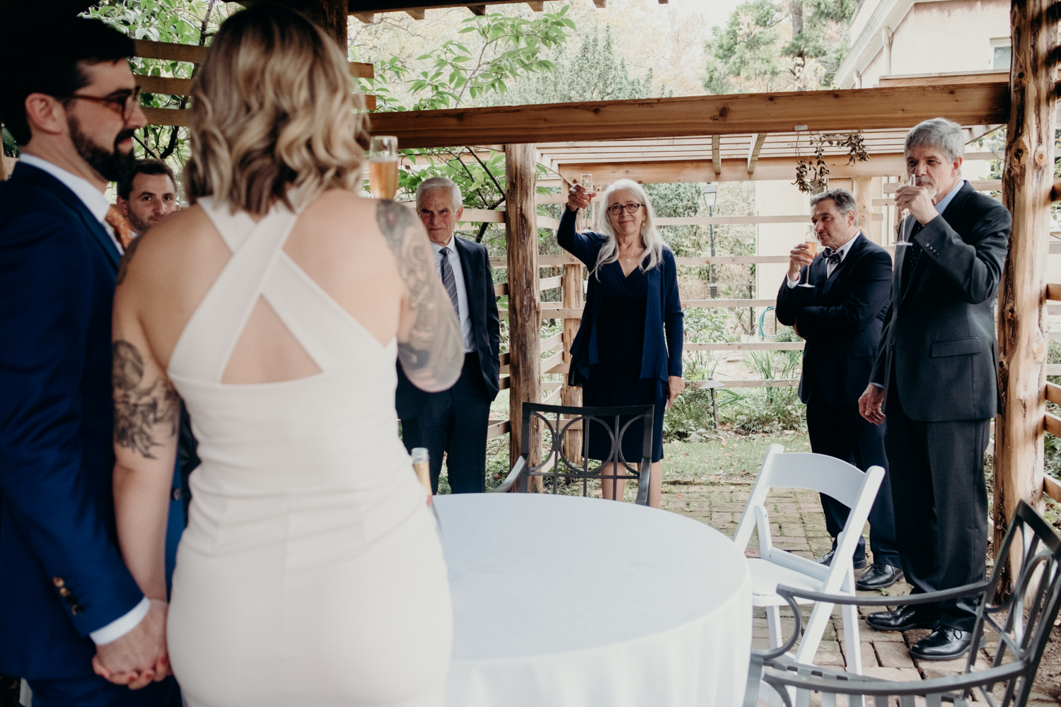 family toasts the new bride and groom