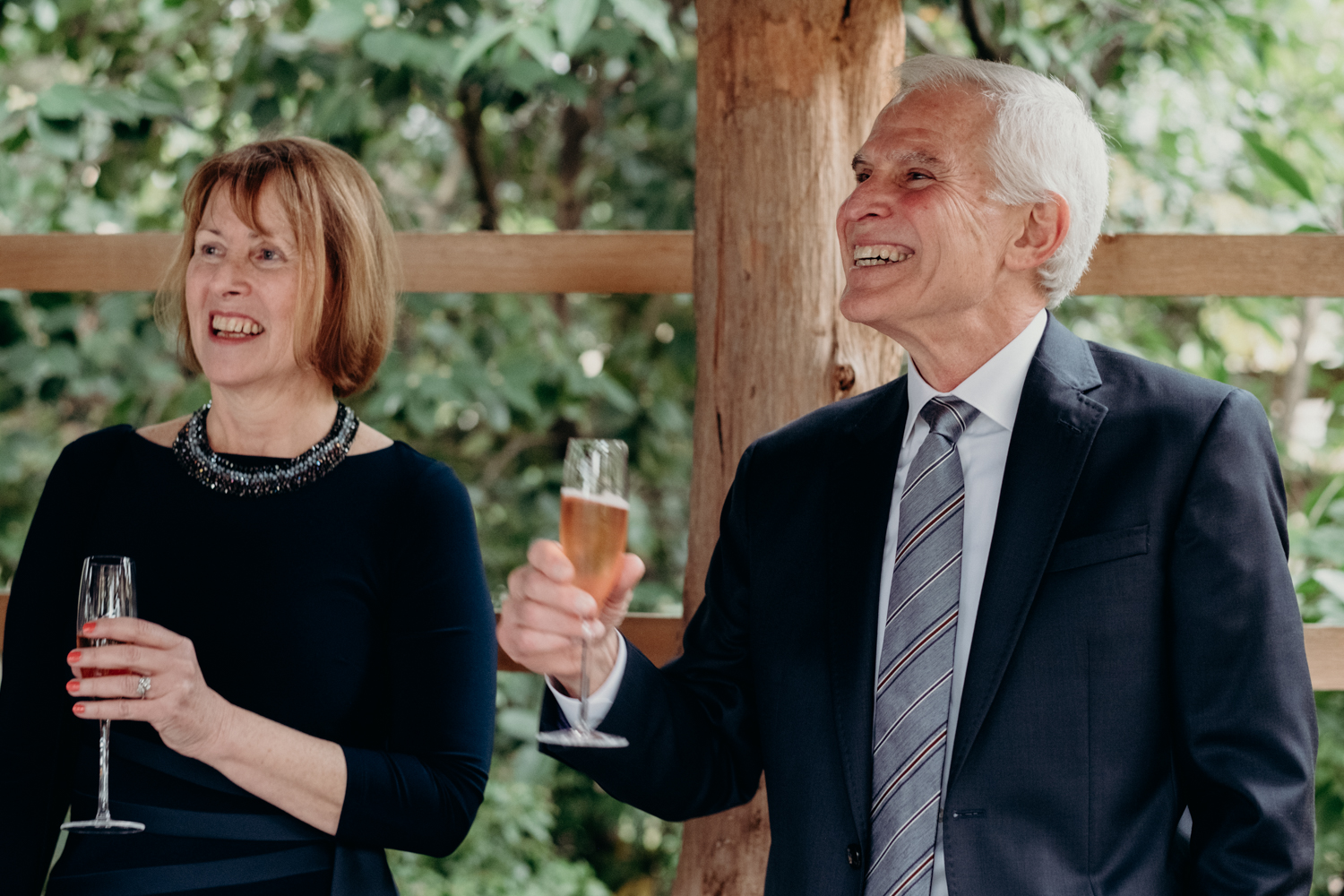 groom's parents toast the couple