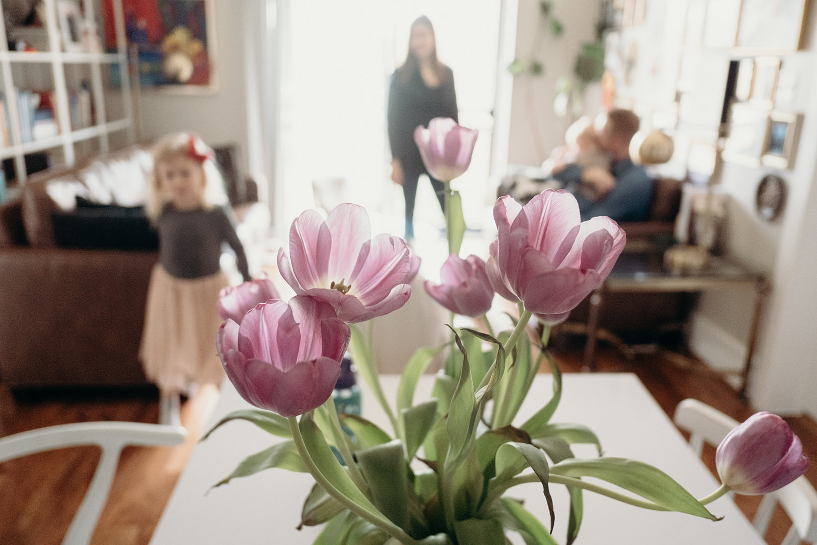 A bouquet of tulips adorns the kitchen table of a family in a little apartment in Washington, DC.