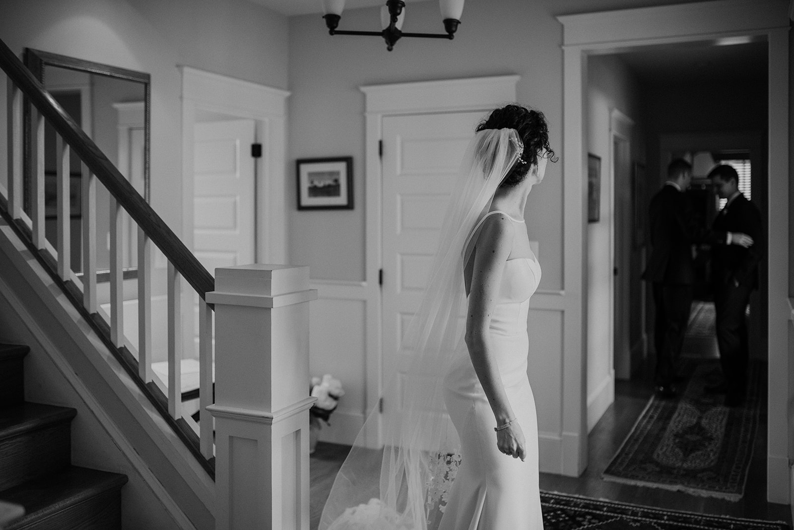 A bride looks back at her groom before he goes to walk down the aisle at their outdoor wedding ceremony at Blue Hill Farm in Waterford, VA. 