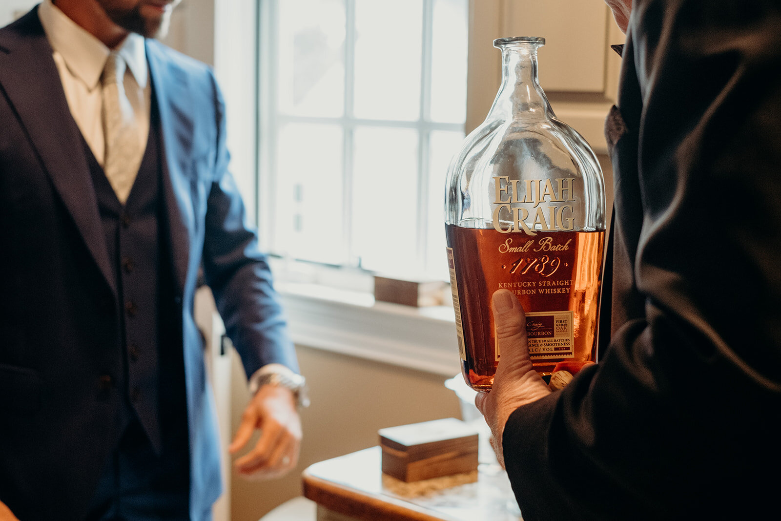 Groomsmen prepare a toast before an outdoor garden wedding at The Retreat at Eastwood Farm in Warrenton, VA. 