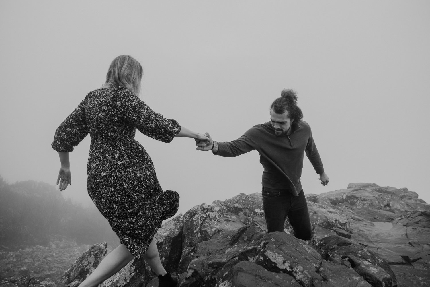 Couple hiking over rocks the top of Stony Man mountain