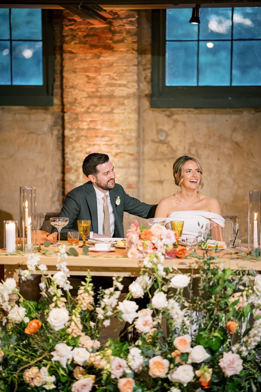 Wedding couple listening to toasts at reception at The Winslow.