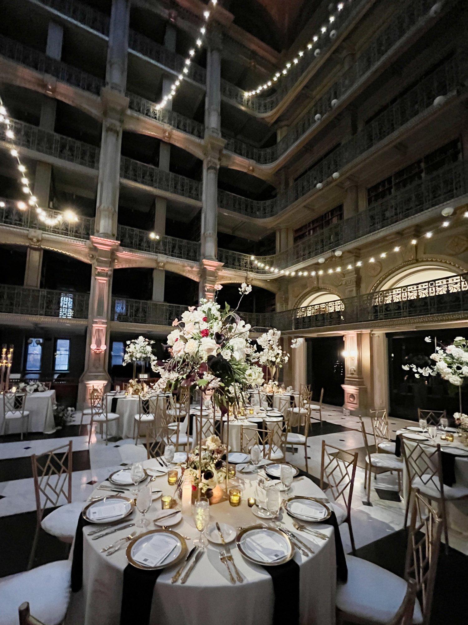 George Peabody wedding reception layout with tables and florals